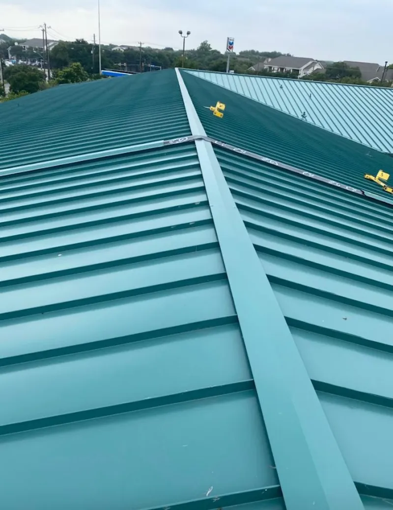 Green commercial metal roof ridge and valley for Metal Roof Repair in Moraine